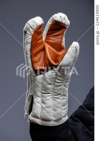 Quilted Medieval Gloves with Leather Palm. Warm and comfortable handwear featuring a padded design and a durable leather grip. Quilted Medieval Gloves with Leather Palm. Warm and comfortable handwear featuring a padded design and a durable leather grip. 124619895