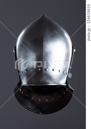 Polished Silver Medieval Armet Helmet with Perforated Visor. This shiny silver armet features a rounded skull, a protective bevor, and a visor with multiple small perforations. Polished Silver Medieval Armet Helmet with Perforated Visor. This shiny silver armet features a rounded skull, a protective bevor, and a visor with multiple small perforations. 124619919