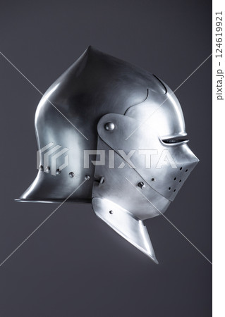 Polished Silver Medieval Armet Helmet with Perforated Visor. This shiny silver armet features a rounded skull, a protective bevor, and a visor with multiple small perforations. Polished Silver Medieval Armet Helmet with Perforated Visor. This shiny silver armet features a rounded skull, a protective bevor, and a visor with multiple small perforations. 124619921
