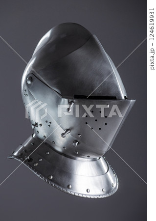 Shiny Silver Medieval Armet Helmet with Visor. This polished silver armet features a hinged visor and bevor, offering full head protection in medieval style. 124619931