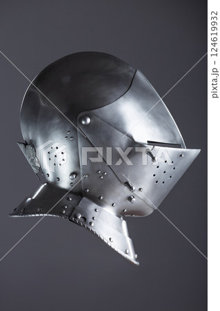 Shiny Silver Medieval Armet Helmet with Visor. This polished silver armet features a hinged visor and bevor, offering full head protection in medieval style. 124619932