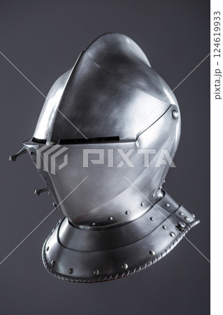 Shiny Silver Medieval Armet Helmet with Visor. This polished silver armet features a hinged visor and bevor, offering full head protection in medieval style. 124619933