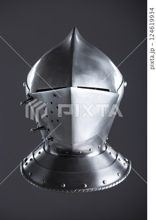 Shiny Silver Medieval Armet Helmet with Visor. This polished silver armet features a hinged visor and bevor, offering full head protection in medieval style. 124619934