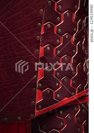 Close-up of Brown Leather Fantasy Armor Plates. Detailed view of the intricate leather plates and rivet construction. 124619990