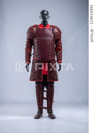Brown Leather Fantasy Armor Set for LARP Cosplay. Full costume on a mannequin with intricate details and red accents. 124619995