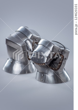 Pair of Silver Steel Gauntlets with Leather Interior. This image shows a pair of shiny silver steel gauntlets with a more basic and robust design compared to previous examples. The interior appears to Pair of Silver Steel Gauntlets with Leather Interior. This image shows a pair of shiny silver steel gauntlets with a more basic and robust design compared to previous examples. The interior appears to 124620101
