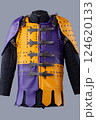 Colorful Brigandine Armor with Studs and Buckles. This image shows a vibrant piece of brigandine armor, featuring a combination of purple and yellow leather sections adorned with studs and secured 124620133
