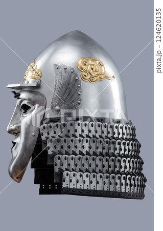 Silver Samurai Helmet with Ornate Gold Details and Fierce Mask. This image showcases a silver samurai helmet with intricate gold decorations on the crown and a detailed face mask with a stern Silver Samurai Helmet with Ornate Gold Details and Fierce Mask. This image showcases a silver samurai helmet with intricate gold decorations on the crown and a detailed face mask with a stern 124620135