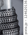 Detailed View of Silver Samurai Armor Plates and Lacing. This image provides a close-up view of silver samurai armor, showcasing the intricate overlapping plates and the dark lacing that holds them 124620136