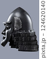 Dark Samurai Helmet with Menacing Face Mask. This image features a dark, almost black, samurai helmet with a detailed face mask displaying a fierce expression. 124620140