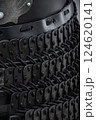 Close-Up of Black Samurai Armor Plates. This image shows a detailed close-up of black samurai armor, featuring numerous small, overlapping plates connected by dark cords. 124620141