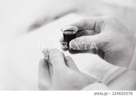 Holy Week Church Communion, Christians praying with bread and wine symbolizing the holy blood and body of Jesus, Lenten Easter background 124620376