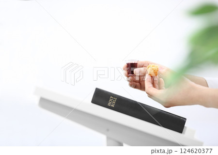 Holy Week Church Communion, Christians praying with bread and wine cups symbolizing the holy blood and body of Jesus, Lenten Easter background 124620377