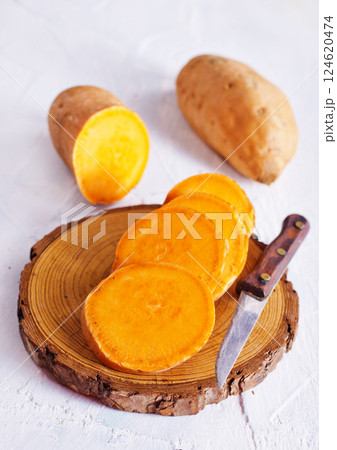 fresh sweet potatoes on a light rustic background. 124620474