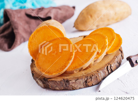 fresh sweet potatoes on a light rustic background. 124620475