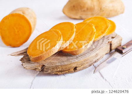 fresh sweet potatoes on a light rustic background. 124620476