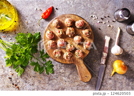Meatballs from raw minced meat on gray table 124620503
