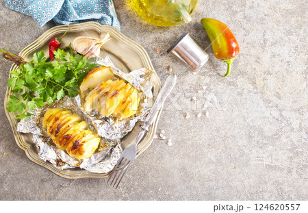 Stuffed potato with bacon, cheese and green onion Stuffed potato with bacon, cheese and green onion 124620557