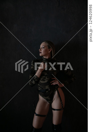 Beautiful fashionable military woman clothes and boots 124620998