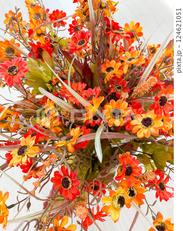 Bright orange autumn flowers on a white background 124621051