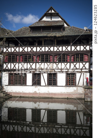 Half-timbered historic building reflected in Strasbourg, Alsace, France Half-timbered historic building reflected in Strasbourg, Alsace, France 124623285