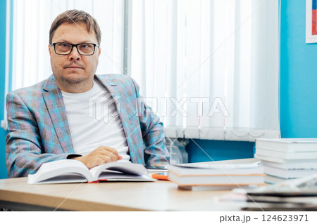 man working online on laptop at desk in office man working online on laptop at desk in office 124623971