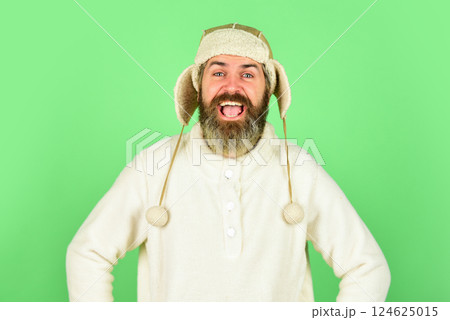 Bearded hipster. Hairdresser salon. Barber services. Bearded man wear hat with ear flaps. Furry accessory. Winter fashion. Cold weather. Beard care winter season. Facial hair concept. Fur garments Bearded hipster. Hairdresser salon. Barber services. Bearded man wear hat with ear flaps. Furry accessory. Winter fashion. Cold weather. Beard care winter season. Facial hair concept. Fur garments 124625015