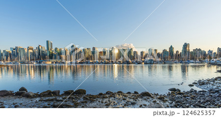 Vancouver downtown skyline panoramic view at sunset time. Skyscrapers reflection on the Vancouver Harbour. British Columbia, Canada. 124625357