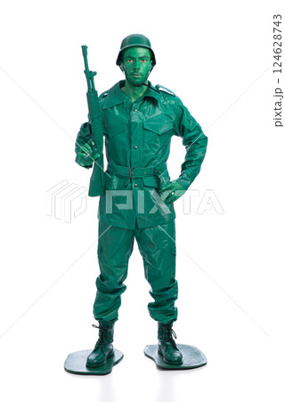 Man on a green toy soldier costume 124628743