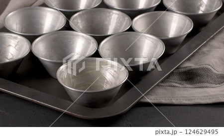 Baking forms smeared with butter Baking forms smeared with butter 124629495