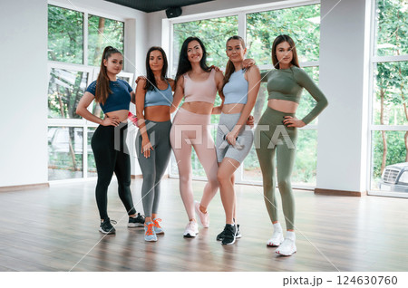 Standing together. Group of women practicing fitness in the gym Standing together. Group of women practicing fitness in the gym 124630760