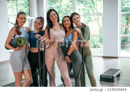 Standing together. Group of women practicing fitness in the gym Standing together. Group of women practicing fitness in the gym 124630844