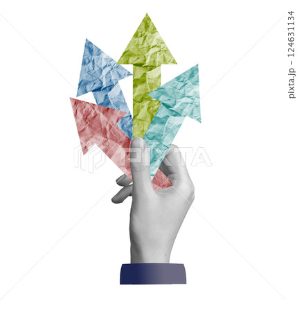 Opportunity and aspiration. A hand holding arrows pointing in different directions, representing Opportunity and aspiration. A hand holding arrows pointing in different directions, representing 124631134