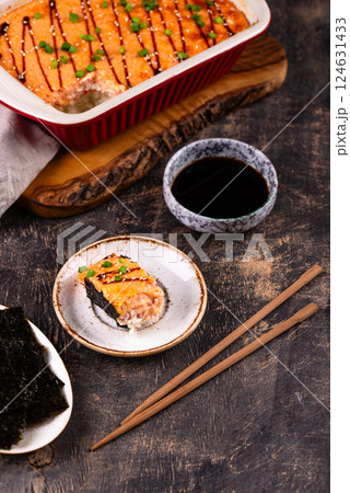 Baked sushi roll cake with crab surimi sticks Baked sushi roll cake with crab surimi sticks 124631433