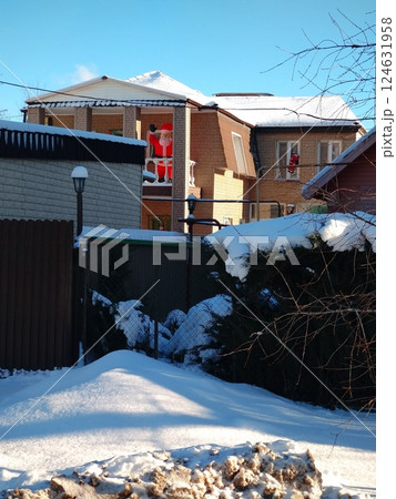 Snowy House with Festive Santa Decorations 124631958
