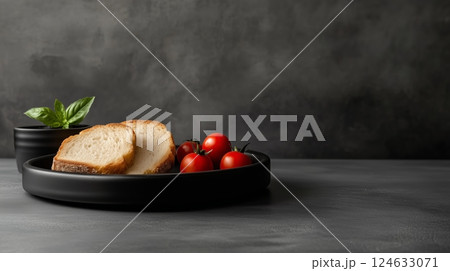 A kitchen with a black table with a black plate and sliced breads toasted on it 124633071