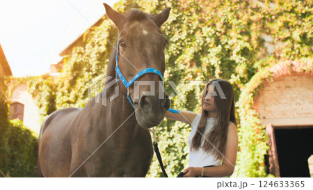 Young girl with a beloved horse on a summer day. Young girl with a beloved horse on a summer day. 124633365