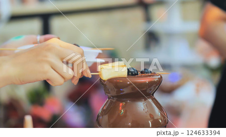 Fruit, berries prepared chocolate fountain. Wedding celebration. Fruit, berries prepared chocolate fountain. Wedding celebration. 124633394