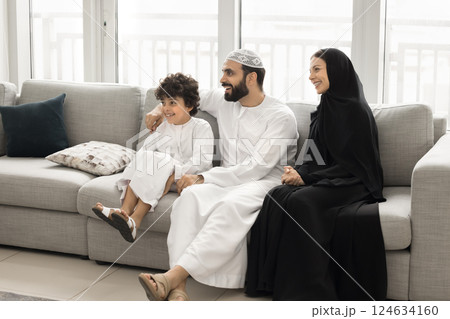 Arabic family with son resting on sofa 124634160