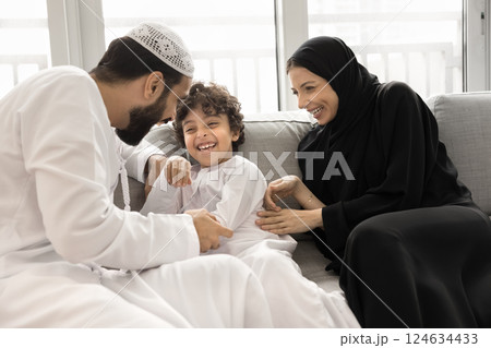 Happy Arabian family enjoy playtime at home 124634433
