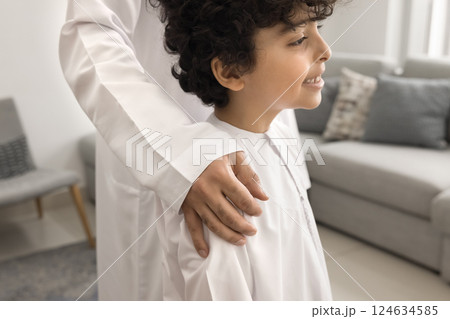 Arabian man and son standing in living room, close up 124634585