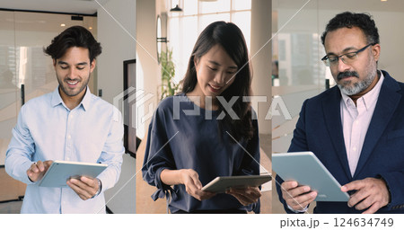 Three business professionals standing in office using modern tablets devices Three business professionals standing in office using modern tablets devices 124634749