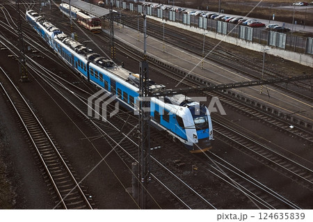 Passenger train at a raiway station Passenger train at a raiway station 124635839