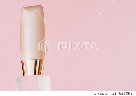 Cosmetic package showcase. Foundation bottle, make-up cream tube 124636098