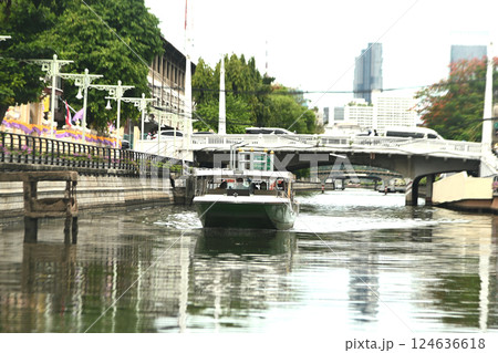 Solar-powered boats pick up, drop off passengers, and provide transportation in the Phadung Krung Kasem canal, Bangkok city. 124636618
