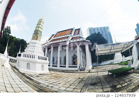 White Buddhism Church and Pagoda at Wat Nang Chee Chotikaram has an ordination hall without the raka's leaf chorfa and swan's tail, Located at Bangkok capital city in Thailand. 124637939