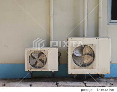 Air Conditioning Units Installed on Wall in Urban Environment Air Conditioning Units Installed on Wall in Urban Environment 124638196