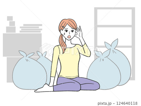 ゴミ袋に囲まれて疲れた女性 124640118
