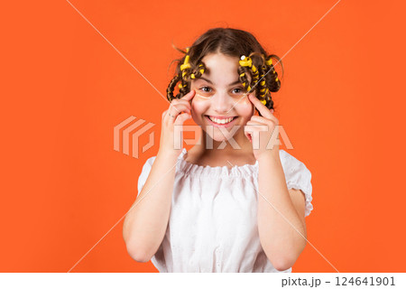 get refreshed. beauty and fashion. small girl has hair curler papillotes. kid hairdresser salon. healthy long hairstyle. hair care for child. little woman grooming with hair roller. eye therapy patch 124641901
