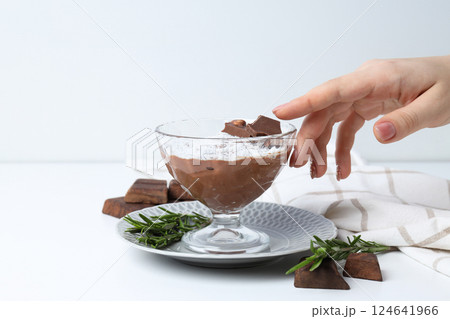 Chocolate mousse and ingredients on a light background. 124641966